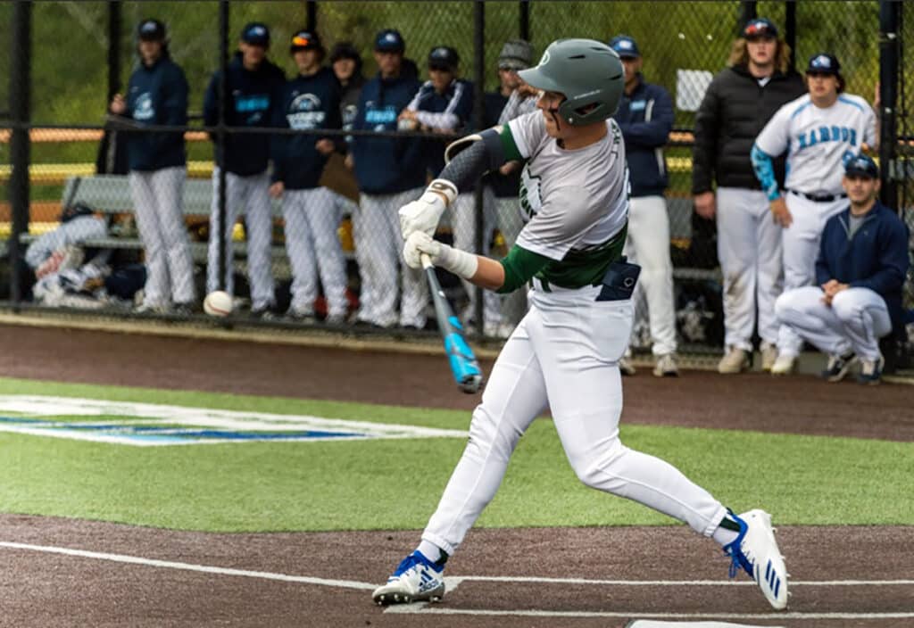 Peninsula's Payton Knowles connects on a belt-high fastball.