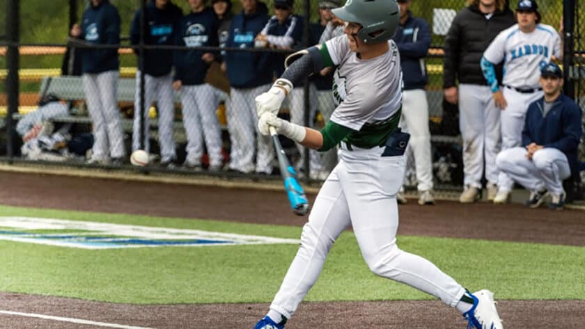 Peninsula's Payton Knowles connects on a belt-high fastball.