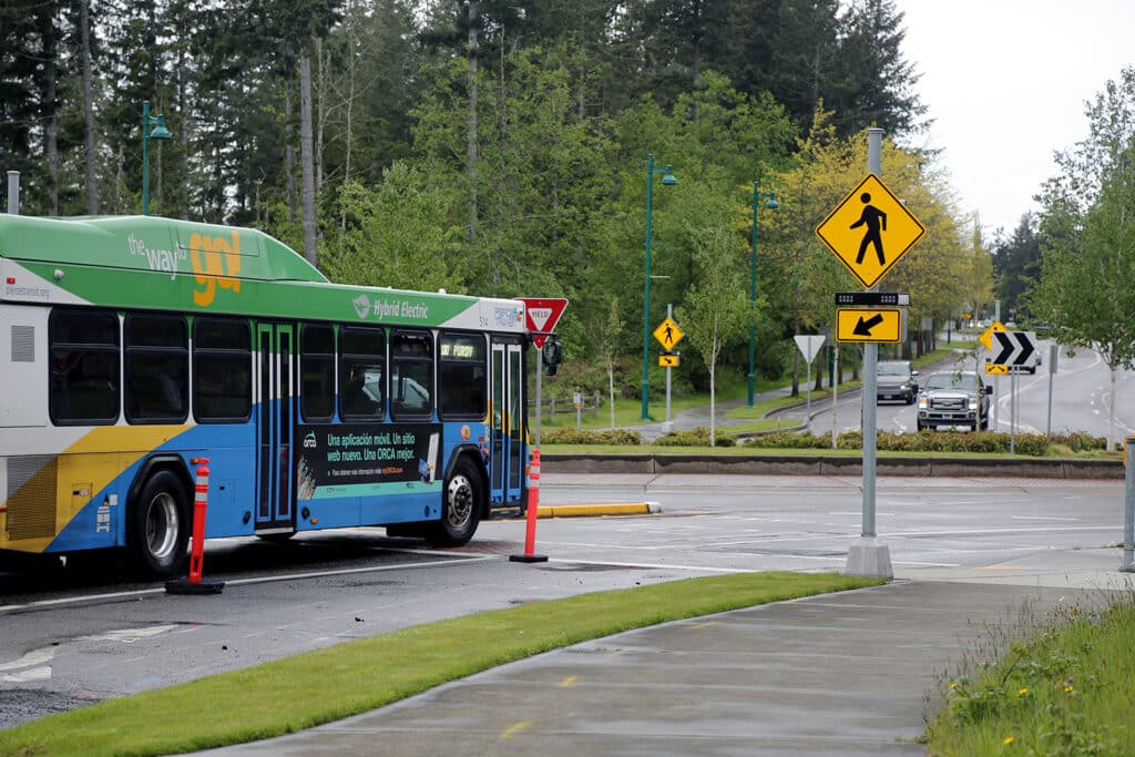 A Pierce Transit bus navigates one of the roundabouts on Borgen Boulevard on May 19.