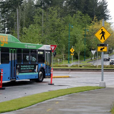 A Pierce Transit bus navigates one of the roundabouts on Borgen Boulevard on May 19.
