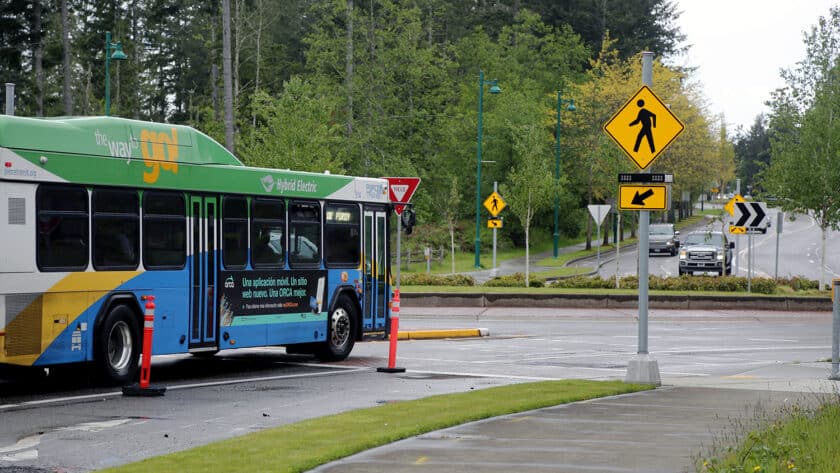 A Pierce Transit bus navigates one of the roundabouts on Borgen Boulevard on May 19.