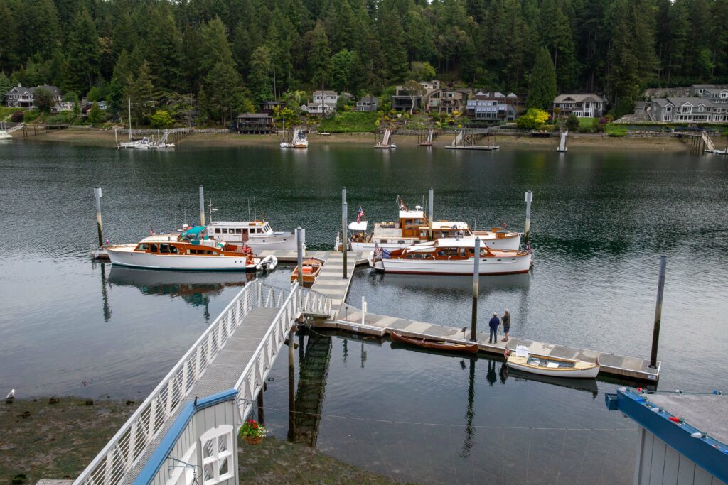 Classic Boats tie up at Tides Tavern for the 2019 Classic Boat Show.