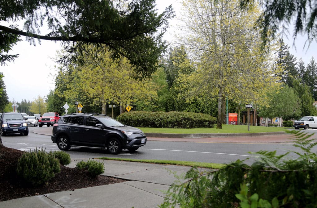 Vehicles move through the roundabout near the Target store on Borgen Boulevard.