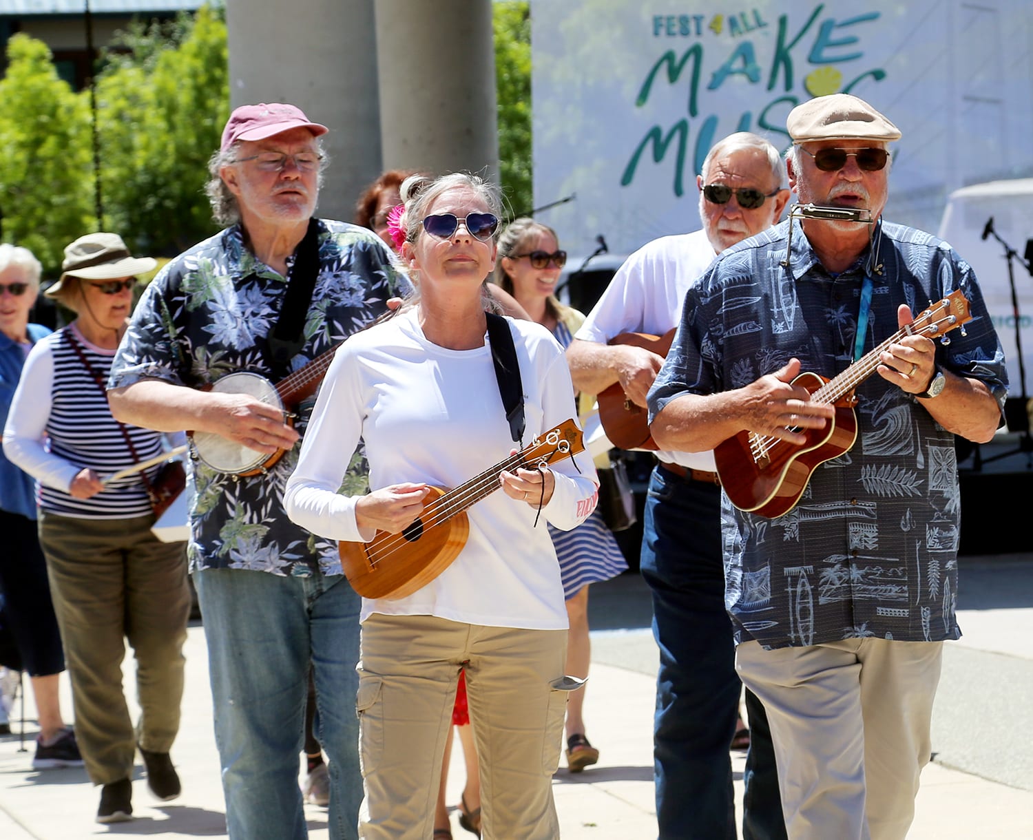 Musicians parade between stages during Make Music Day, June 21, at Uptown Gig Harbor.