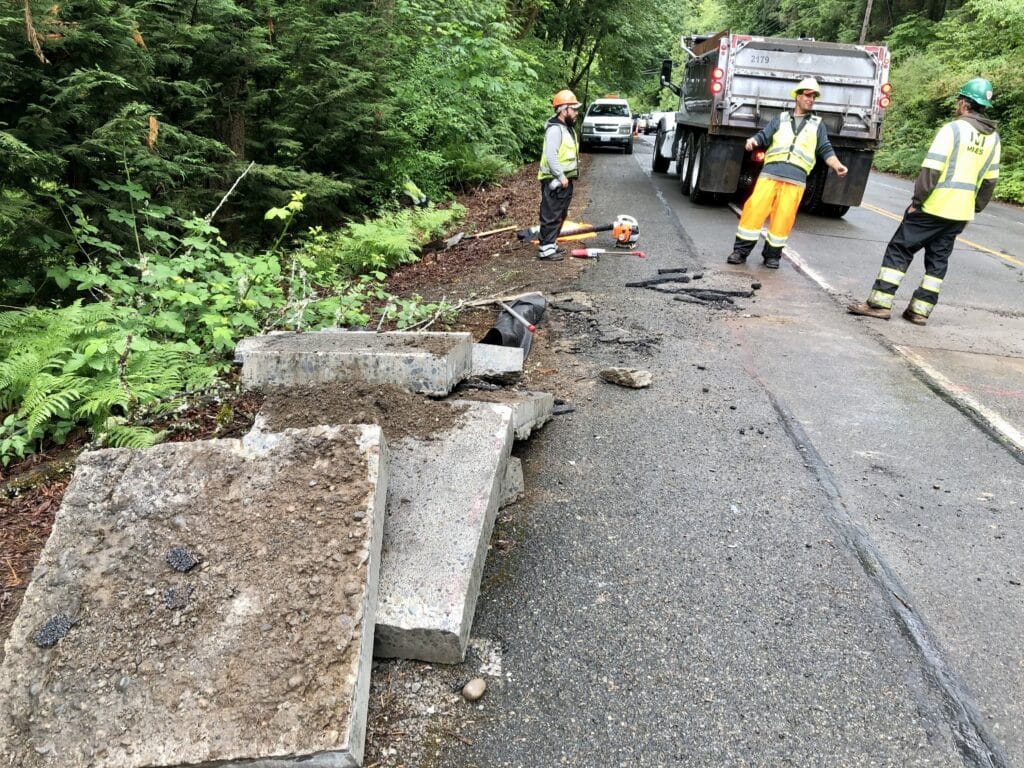 Miles Resources workers working on Point Fosdick Drive project