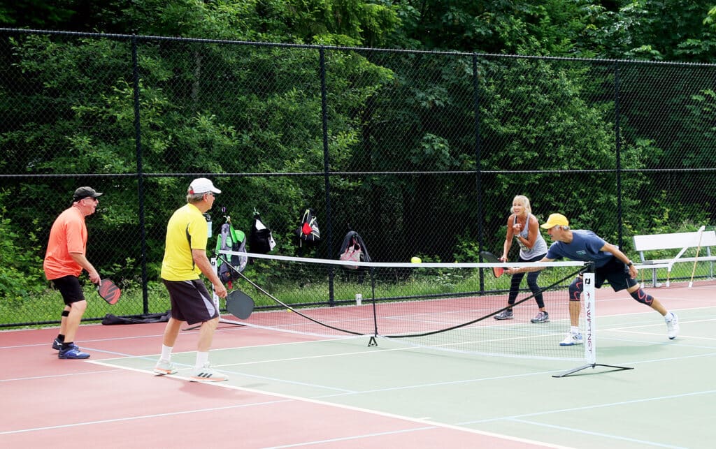 Pickleball players get in a game on June 21, 2021, at Sehmel Homestead Park.