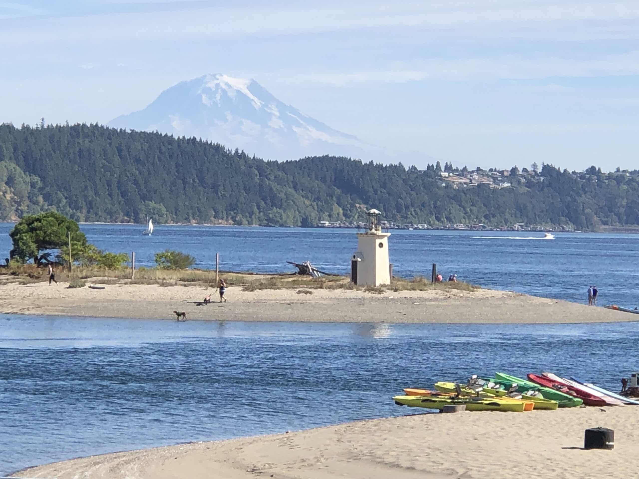 The property overlooks the lighthouse at the entrance to the harbor and is backdropped by Puget Sound and Mount Rainier,