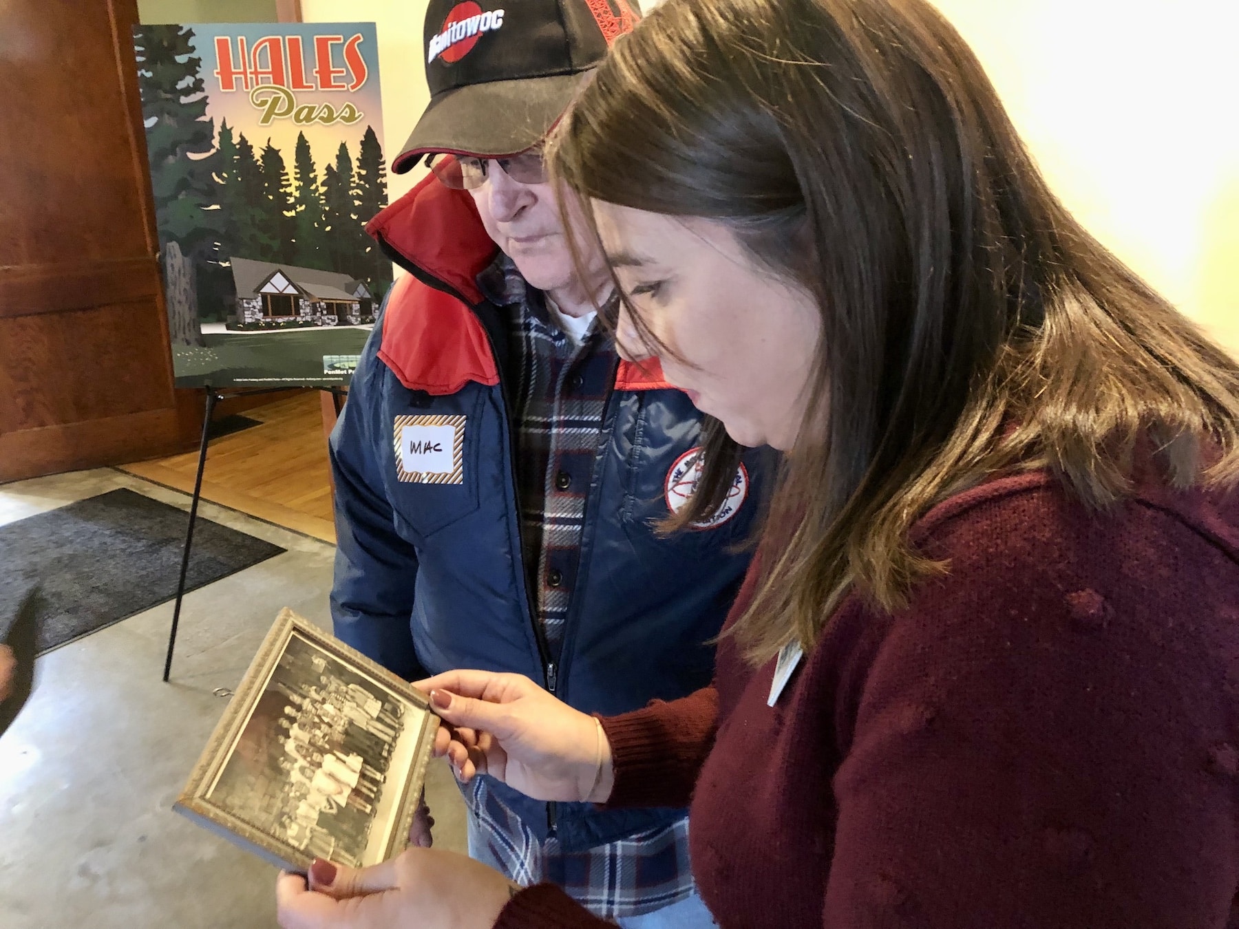 Mac Fields shows PenMet Executive Assistant Robyn Readwin a picture of his 1947 first-grade class.
