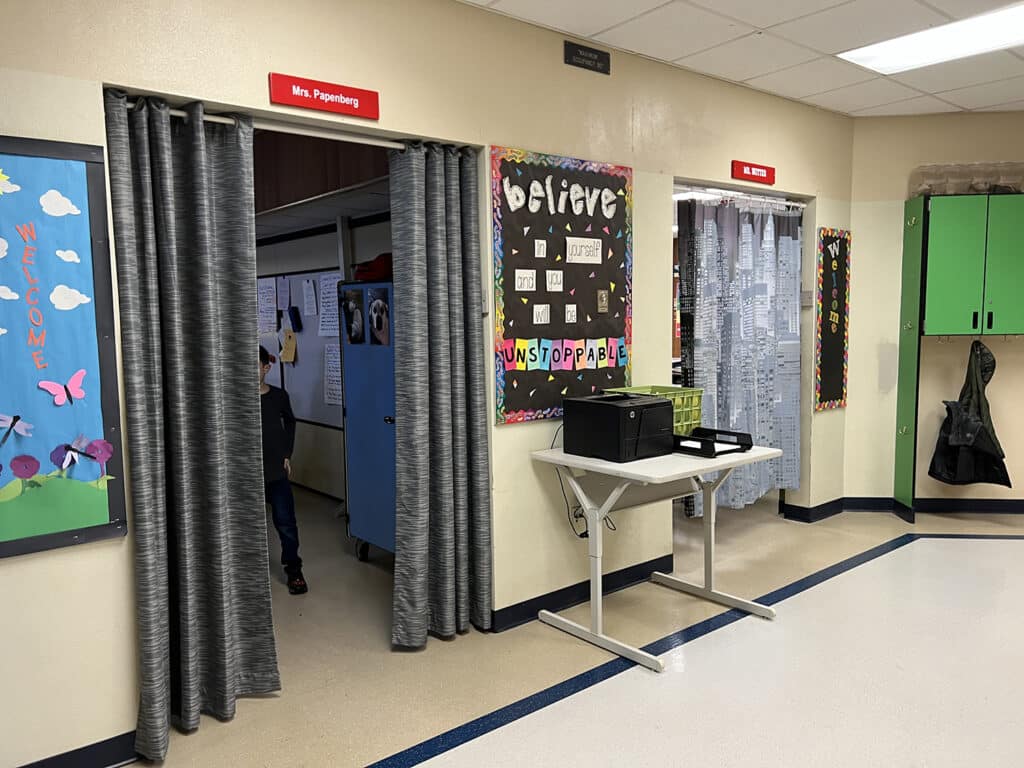 Curtains on some classrooms openings at Discovery Elementary School reduce noise and outside light during class time. The district is adding doors over the summer.