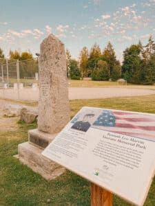 Stone monument in a obelisk shape, at a grassy park