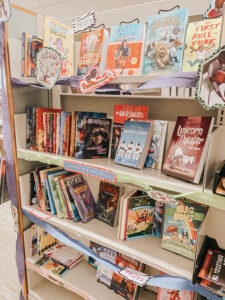 Room with bookshelves and kids books displayed