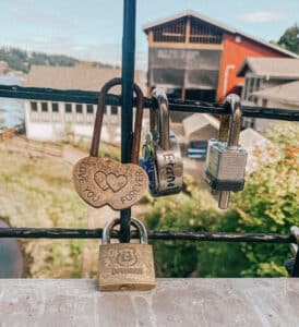 This is a picture of padlocks hanging from bridge cables