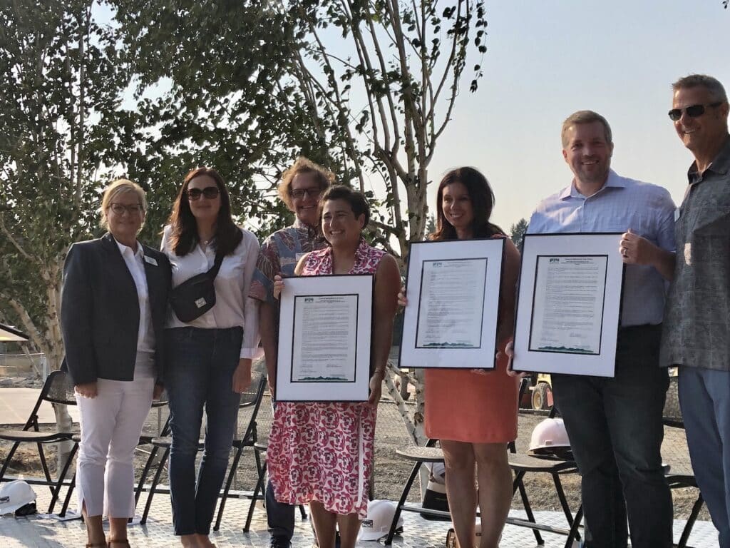 From left, board members Missy Hill, Lauren Kingsbury, Kurt Grimmer with Sen. Emily Randall, Rep. Michelle Caldier, Rep. Spencer Hutchins and Board President Steve Nixon.