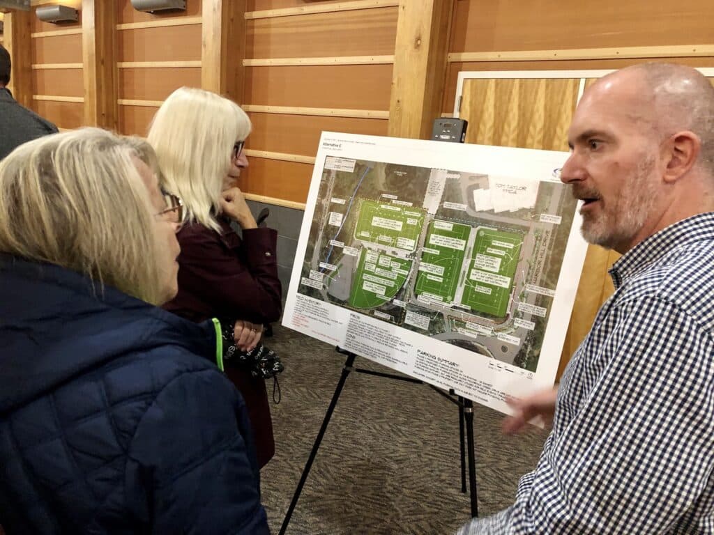 Sisters Carmela and Rosemary Micheli share their concerns about tree loss and parking with consultant Eric Streeby.