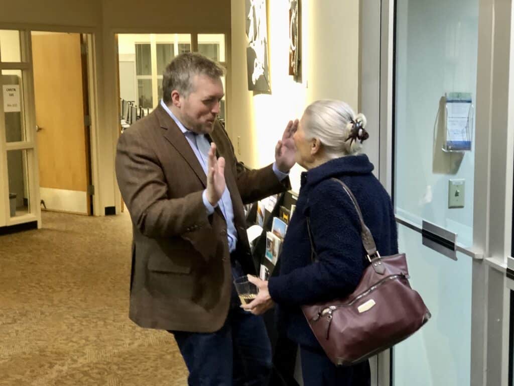 Rep. Spencer Hutchins speaks with a constituent Wednesday during the legislative sendoff.