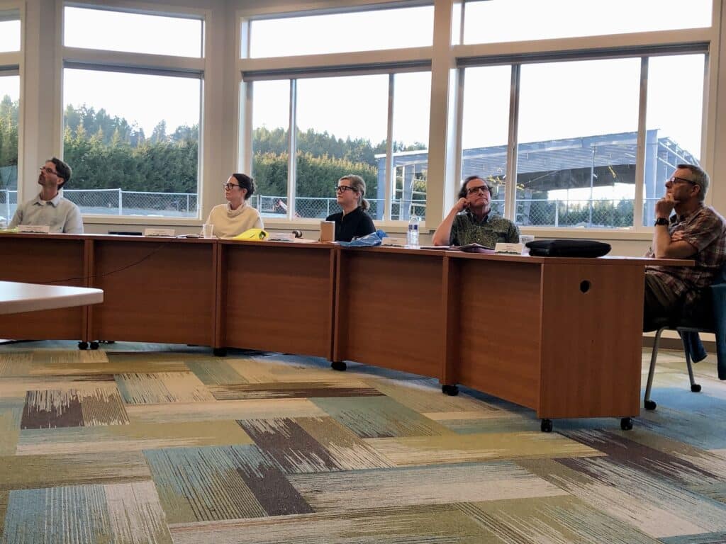 PenMet commissioners, from left, Billy Sehmel, Laurel Kingsbury, Missy Hill, Kurt Grimmer and Steve Nixon listen at Tuesday's board meeting. Steel beams for the new community recreation center are in the background.