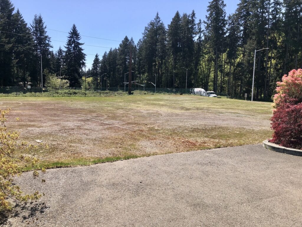 A 140-car parking lot sits between Wollochet and Filmore drives.