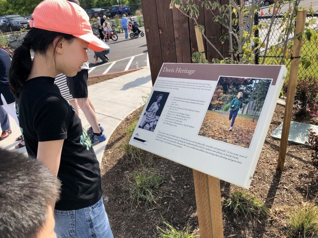 Allyson Lin, 13, of Harbor Hill reads the Doris Heritage signboard.