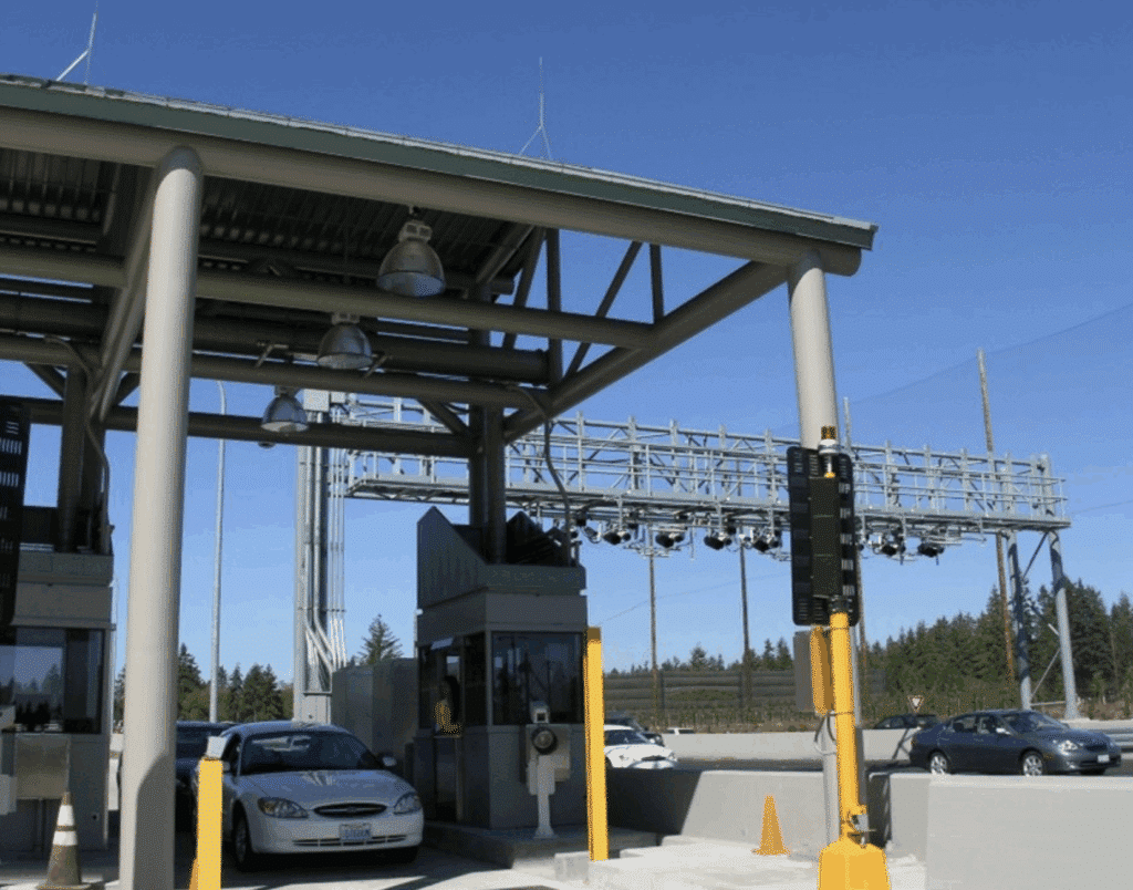 Tolling equipment includes cameras, readers, sensors and lights.