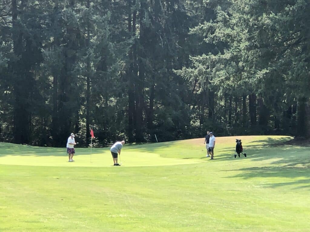 Golfers playing a round Sunday at Madrona Links.