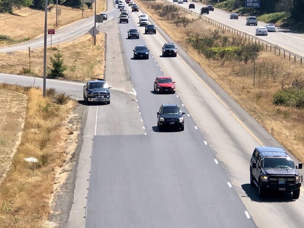 A car enters westbound Highway 16 from Wollochet Drive. A 2018 WSDOT study recommended extending the acceleration lanes within 10 years.