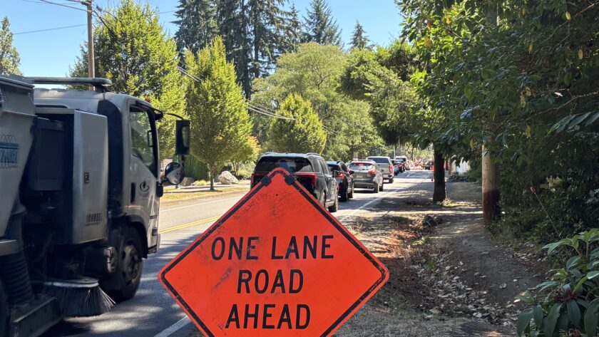 Cars are being directed to one lane at the intersection of 38th Avenue and 56th Street NW in Gig Harbor as workers begin road improvements that include a roundabout at the intersection.