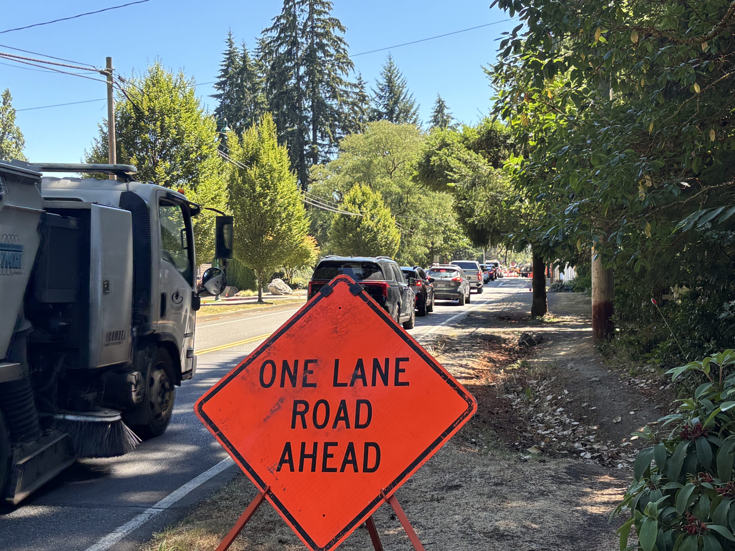 Cars are being directed to one lane at the intersection of 38th Avenue and 56th Street NW in Gig Harbor as workers begin road improvements that include a roundabout at the intersection.