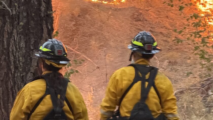 Gig Harbor Fire & Medic One sent four firefighters to Spokane to help contain the blaze. From lefrt is Firefighter/Emergency Medical Technician Chelsea Stayton and Firefighter/Paramedic George Hwang. The three wildland fires in Spokane started on Saturday, burning about 3,500 acres by Tuesday and destroyed about 700 structures.